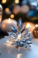 Crystal snowflake ornament with blue tinted facets catching golden bokeh lights against soft white background, creating magical holiday ambiance.