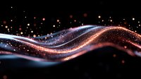 Glowing wave of sparkling particles flowing on black background with orange and blue light trails creating dynamic motion effect and bokeh elements.