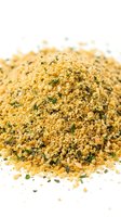 Seasoning blend with herbs and spices isolated on white background, ready for culinary design, packaging, and food styling projects.