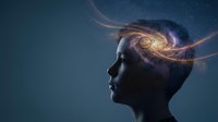 Human head silhouette with glowing brain and energy streams representing consciousness, artificial intelligence, mental power and cognitive processes.