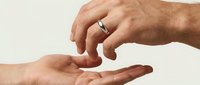 Caring hands reaching toward each other in gentle gesture of support and connection on clean white background for healthcare design.