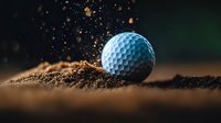 Golf ball on sandy ground with dramatic particle explosion effect creating dynamic sports action scene for athletic marketing materials.