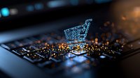 Glowing digital shopping cart icon on computer keyboard with bokeh lights, representing online retail and e-commerce technology in dark setting.