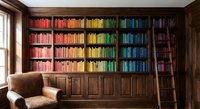 Home library with rainbow colored books arranged by hue on wooden shelves, leather armchair and ladder for cozy reading room interior design.