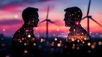 Silhouettes of two people against sunset sky with wind turbines, overlaid with glowing bokeh lights creating magical double exposure effect. Clean energy concept.