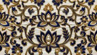 Ornate blue and gold floral damask pattern with intricate scrollwork and lotus motifs on cream background. Seamless repeating design for luxury textiles.