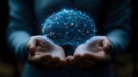 Glowing digital brain network floating above open hands against dark background, representing artificial intelligence and future technology advancement.