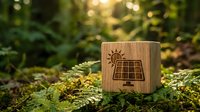 Wooden cube with solar panel icon on moss in forest setting symbolizing renewable energy and sustainable technology in natural environment.