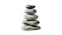 Stacked smooth stones balanced in zen tower formation on white background, isolated for wellness and meditation design projects.