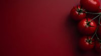 Fresh ripe cherry tomatoes with water drops on dark red background, dramatic food photography composition with copy space for text.