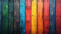 Vibrant multicolored wooden fence planks with rustic texture and metal screws creating rainbow pattern background for creative design projects and decorative purposes.