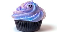 Spooky galaxy cupcake with ghost decoration on swirled purple and blue frosting, sparkly cosmic effect on buttercream, dark chocolate base for Halloween party treats.