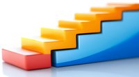 Colorful ascending stair steps in orange, pink and blue on white background illustrating growth, progress and success concepts. Isolated geometric shapes.