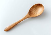 Handcrafted wooden spoon made from natural bamboo on white background, eco-friendly kitchen utensil for cooking and serving food.