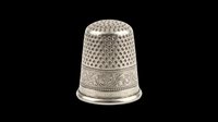 Silver vintage sewing thimble with engraved floral pattern, isolated on transparent background. For clipart, stickers, t-shirt design, print on demand, sublimation.