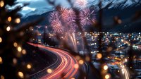 Vibrant fireworks illuminate night cityscape with long exposure light trails from traffic, bokeh effects in foreground create dreamy atmosphere against mountain backdrop.