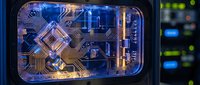 Quantum computer processor chip with glowing circuits and advanced technology components in futuristic computing laboratory environment for scientific research.