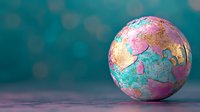 Colorful abstract globe with gold, pink and turquoise marble texture on teal bokeh background. Creative artistic interpretation of Earth for modern design projects.