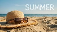 Straw hat and sunglasses on sandy beach with ocean horizon and Summer text in sky, evoking vacation and travel mood.