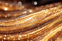Abstract golden waves with glowing sparkles and bokeh effect create luxurious festive background. Shimmering lines flow in elegant curves with magical light.