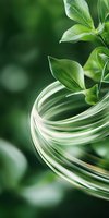 Fresh green leaves with dynamic swirling glass effect on natural bokeh background, representing eco-friendly concept and natural harmony.