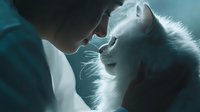 Intimate moment between young couple in bed sharing tender kiss in soft morning light creating romantic atmosphere for relationship concepts.