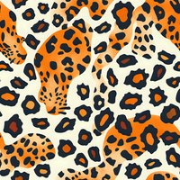 Vibrant leopard print pattern in orange, black and cream colors creates seamless repeat design for fashion, textile and surface pattern applications.