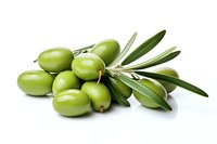 Fresh green olives with leaves isolated on white background. Raw Mediterranean fruit for cooking, oil production and healthy eating.