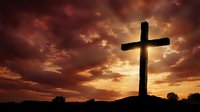 Christian cross silhouette against dramatic sunset sky with golden clouds for religious worship and spiritual faith concepts.