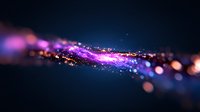 Magical glowing particles with purple and pink light trails floating in dark space, creating ethereal bokeh effect and cosmic atmosphere.