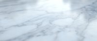White marble surface with natural gray veining patterns creating elegant stone texture for luxury interior design and architectural backgrounds.