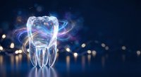 Glowing tooth with magical energy swirls and light effects on dark background for dental care and oral health concepts.
