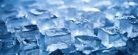 Crystal clear ice cubes scattered on reflective surface with cool blue lighting creating refreshing frozen water blocks for beverages and cooling applications.