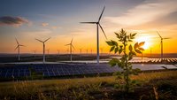 Renewable energy farm with wind turbines and solar panels at golden sunset, sustainable power generation for clean electricity production.
