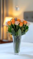 Fresh orange and pink roses with lavender sprigs arranged in crystal vase on white tablecloth, warm sunset lighting creates romantic atmosphere.