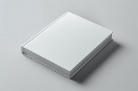 White hardcover book mockup on gray background, blank template for branding design presentation.