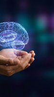 Digital brain hologram floating above cupped hands on dark background with purple and blue lighting effects for technology and innovation concepts.
