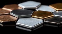 Metallic hexagonal tiles in copper, silver, gold and black colors arranged in geometric pattern with brushed surface texture and selective focus for modern design.
