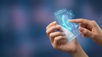 Hands holding transparent smartphone with holographic interface display showing futuristic technology and digital innovation concepts for mobile apps.