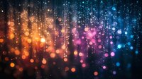 Magical glowing bokeh lights falling like rain against dark background with orange, pink and blue gradient colors creating dreamy atmospheric effect.