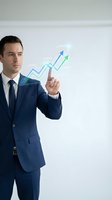 Professional businessman in navy suit touching holographic growth chart with upward trending arrows representing financial success and business analytics.