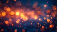 Glowing orange bokeh lights floating against deep blue background with sparkles and particles creating magical atmospheric effect. Suitable for festive designs.