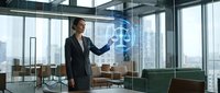 Professional businesswoman interacting with holographic digital interface in modern office environment showcasing future technology and innovation.