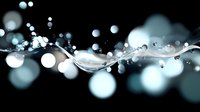 Dynamic water splash with droplets and bokeh effects against dark background, creating elegant liquid motion for cosmetic or beverage advertising.