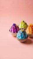Colorful shaved ice desserts in bowls with flower toppings on pink background, perfect for summer treats, frozen food, and dessert menu designs.