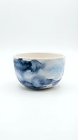 Ceramic bowl with blue watercolor landscape design isolated on white background, suitable for home decor, tableware, and product design applications.