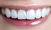 Close up view of healthy white teeth and pink lips showing bright smile with perfect dental care and oral hygiene for dentistry and cosmetic concepts.