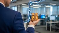 Businessman in dark suit holding gold wrapped gift box with blue ribbon in modern office space decorated with festive lights.