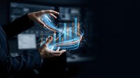 Businessman holding glowing holographic bar chart with upward trend, representing financial growth, data analytics, and digital business strategy.