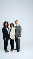 Diverse business team of three professionals in suits standing together on white background for corporate marketing materials.